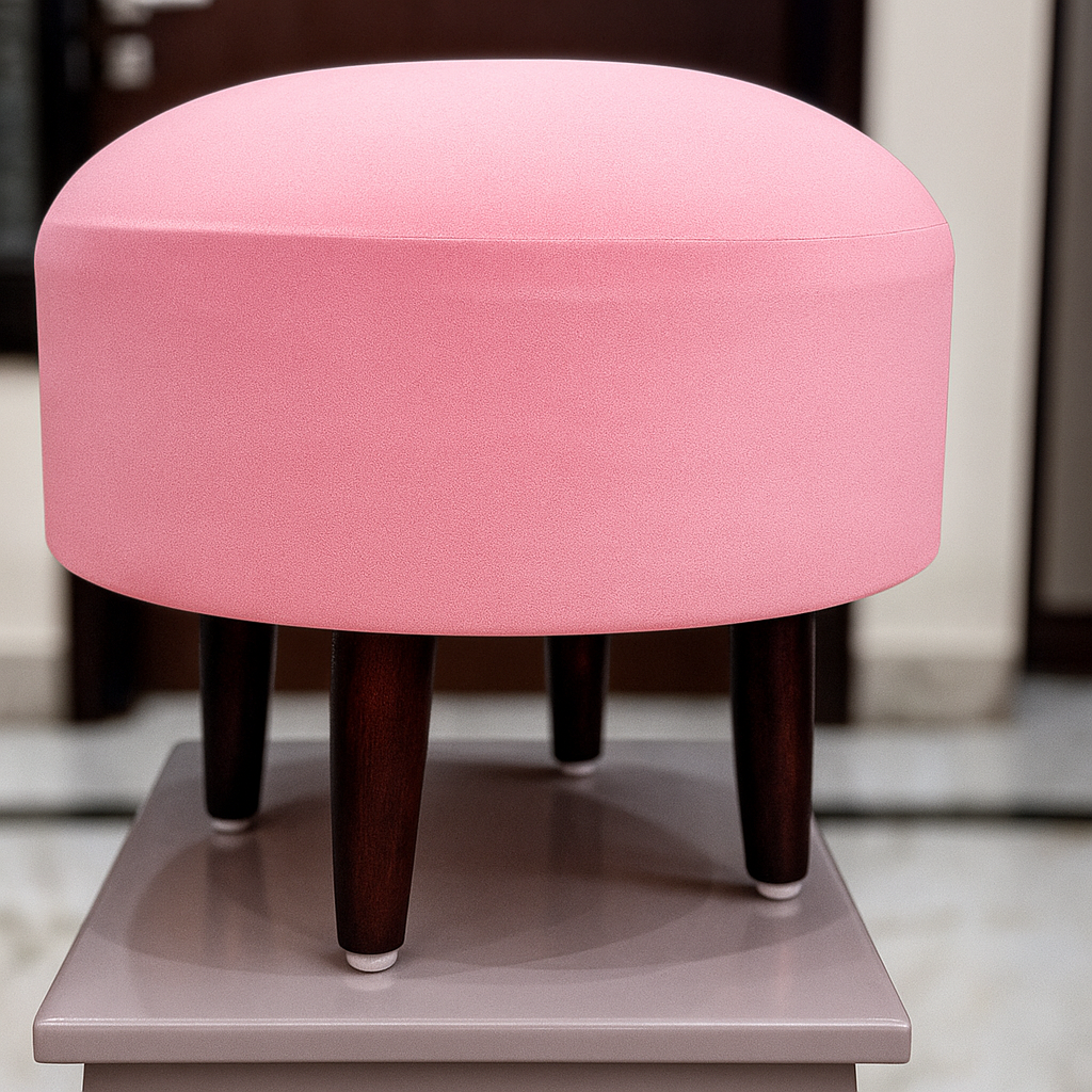 Baby pink ottoman with wooden legs on a neutral background by sinecraft ceations