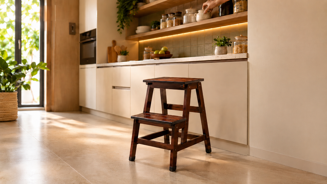Sinecraft foldable 2-ft hardwood step stool in use in Indian modular kitchen reaching top shelf — 10 uses of step stool in Indian home by Sinecraft Creations