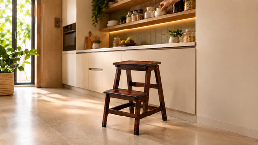 Sinecraft foldable 2-ft hardwood step stool in use in Indian modular kitchen reaching top shelf — 10 uses of step stool in Indian home by Sinecraft Creations