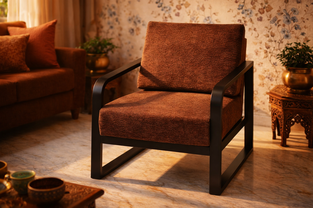 Handcrafted wrought iron lounge chair with chestnut brown  cushion in a warm Indian living room — Sinecraft Creations