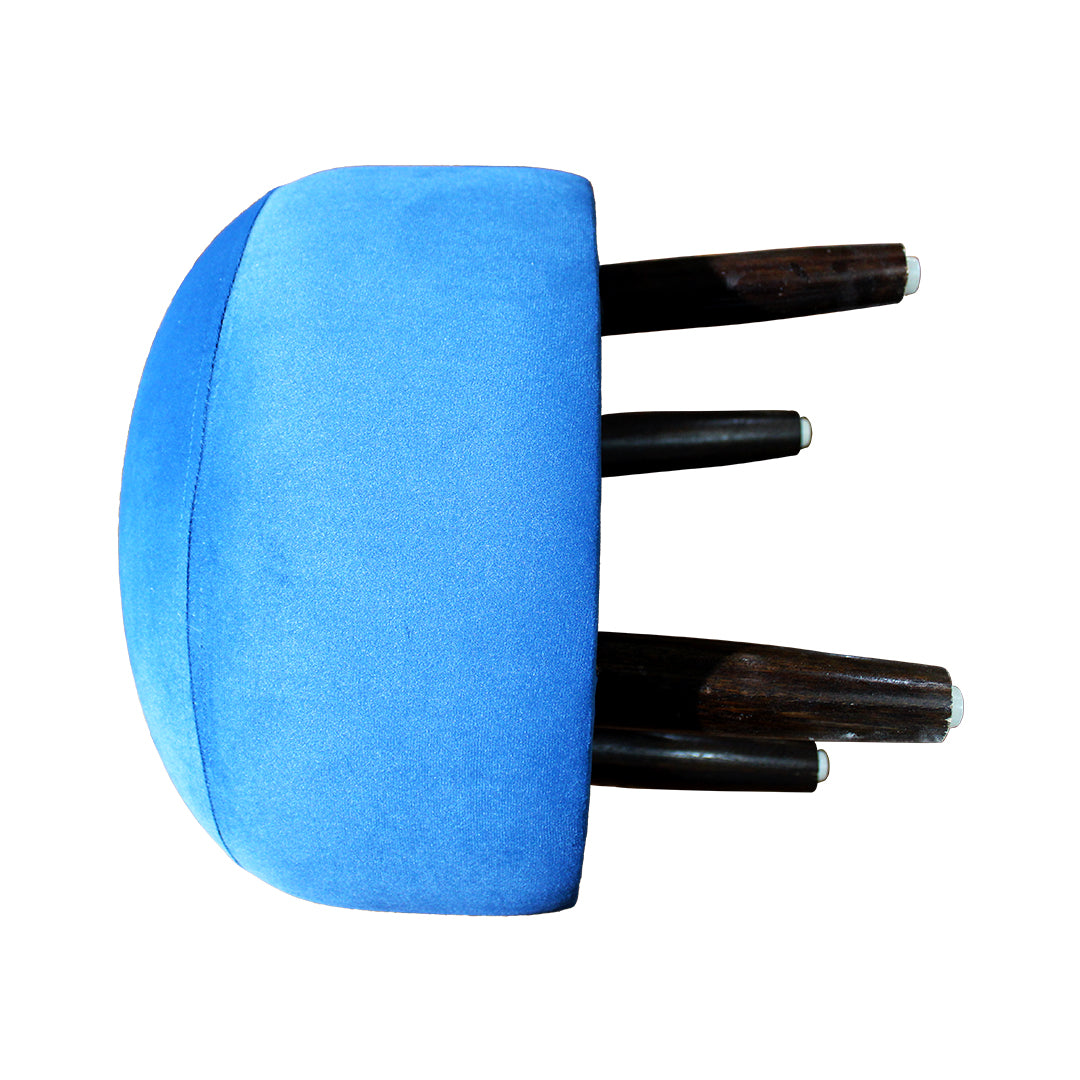 Detail view of dark hardwood leg with floor-protecting buffer on ottoman stool