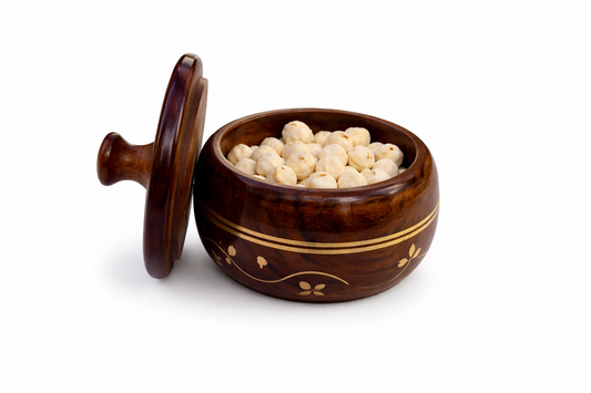 Close-up brass inlay jar and wooden tray finish