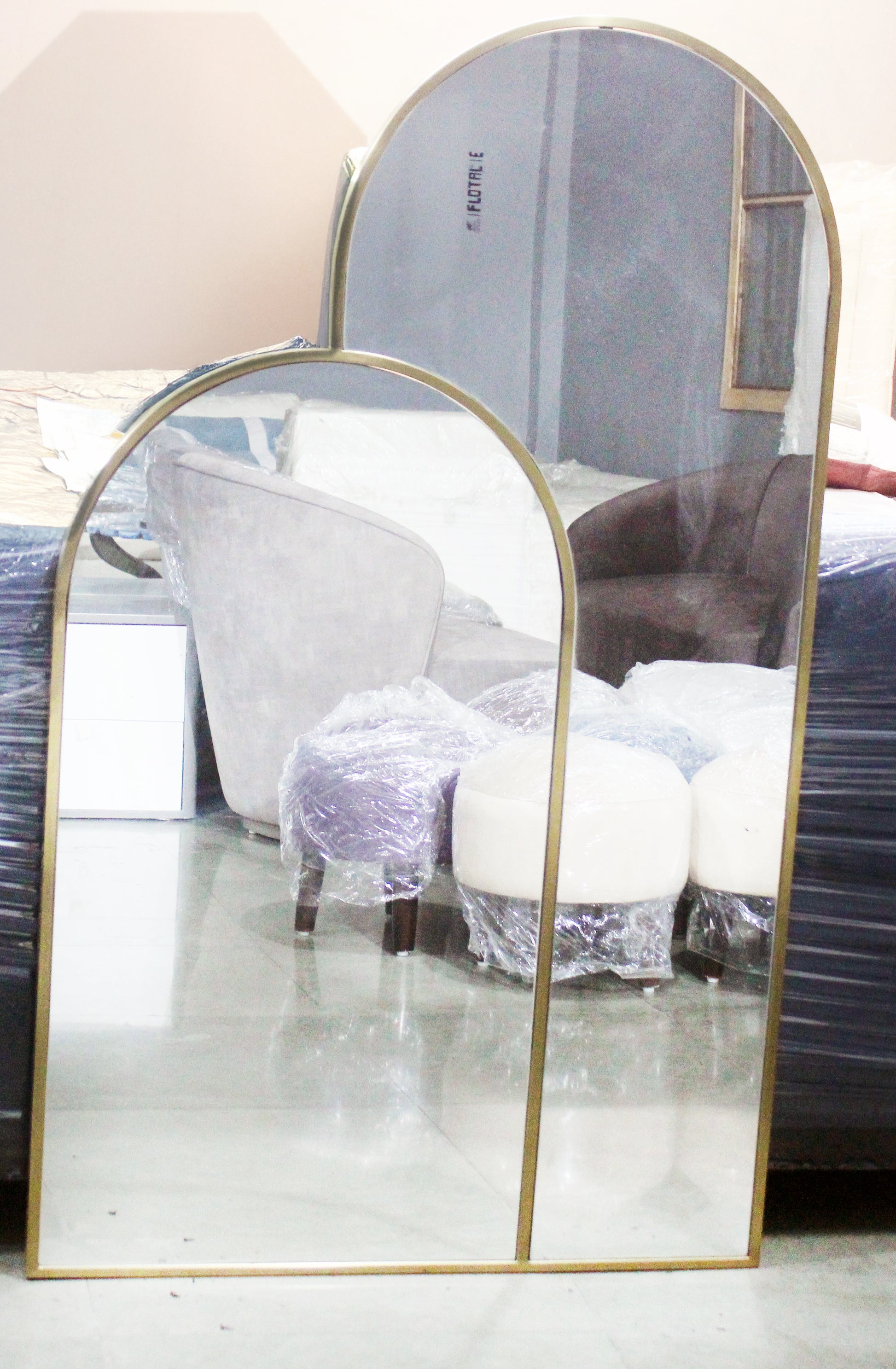 SS PVD gold finish arched overlapping wall mirror with two asymmetrical arches, modern designer mirror for doorways, washrooms, hallways, and living rooms.