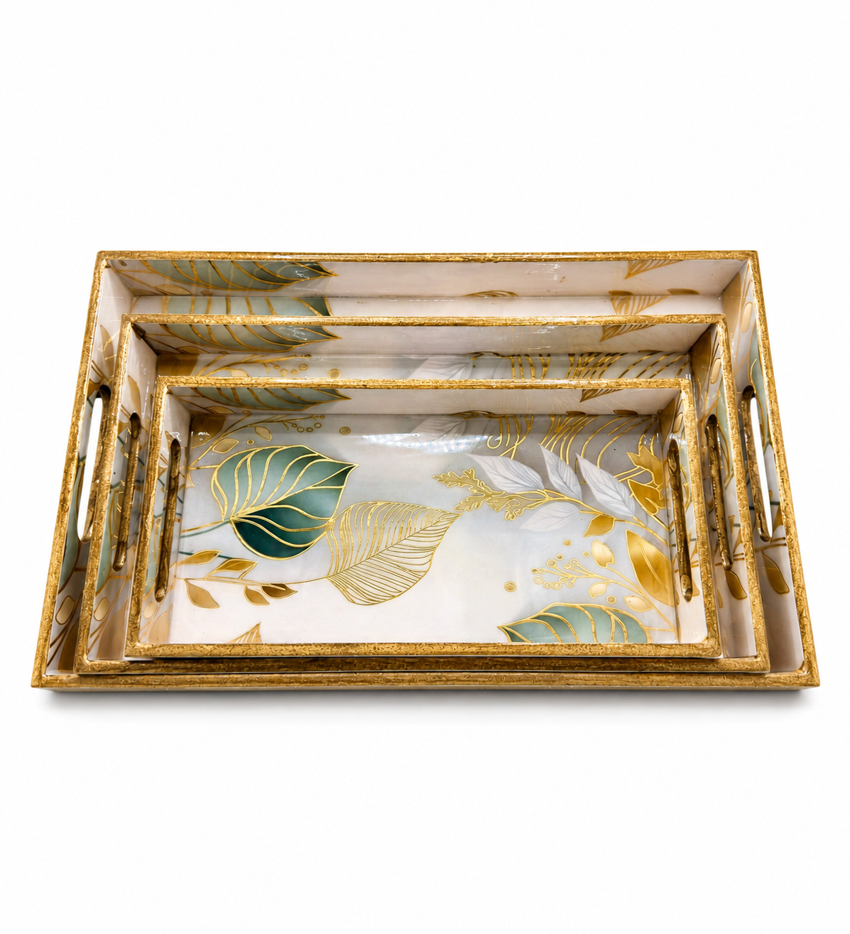 Set of three decorative trays with gold leaf and leaf patterns on a white background