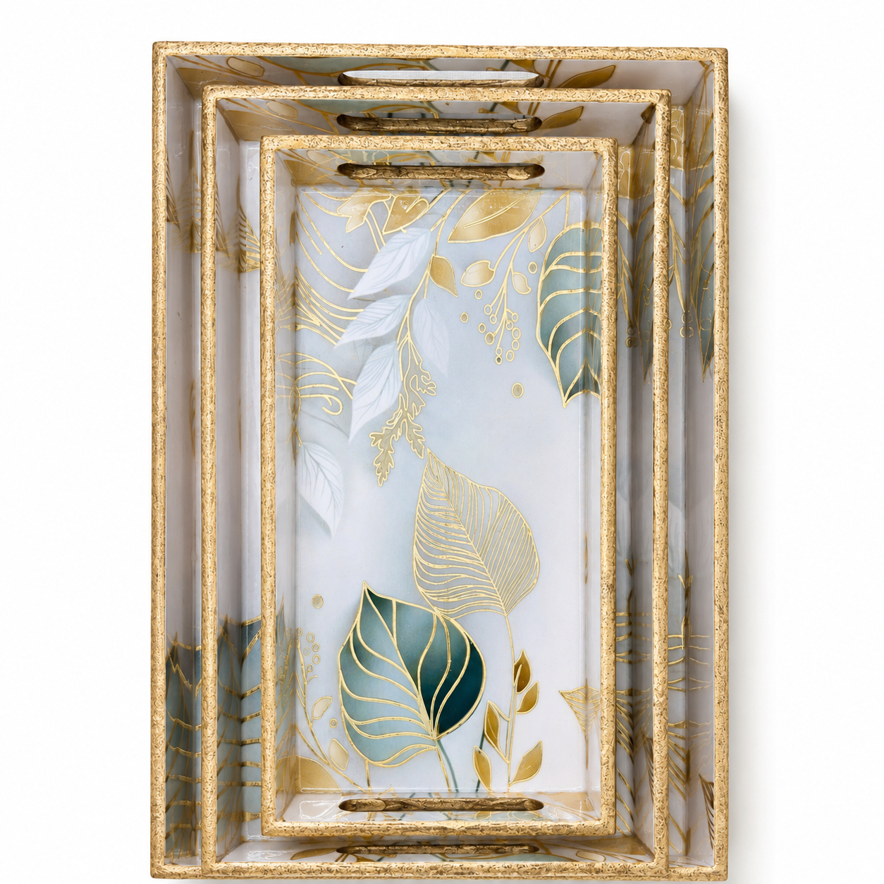 Set of decorative trays with gold leaf patterns on a white background