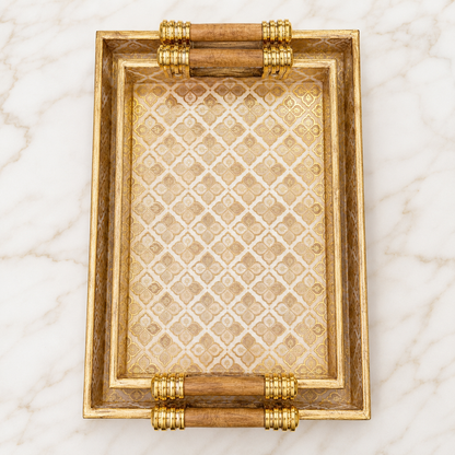 Top view of Royal Gold Trellis enamel-coated serving tray set of 2 with elegant wooden handles and ivory gold geometric pattern