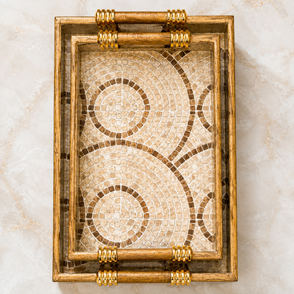 Top view of Sandstone Mosaic Swirl enamel-coated serving tray set of 2 with wooden handles and beige circular mosaic pattern