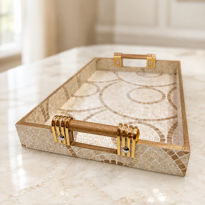 Angled close-up of Sandstone Mosaic Swirl enamel-coated serving tray with elegant wooden handles and beige circular mosaic design