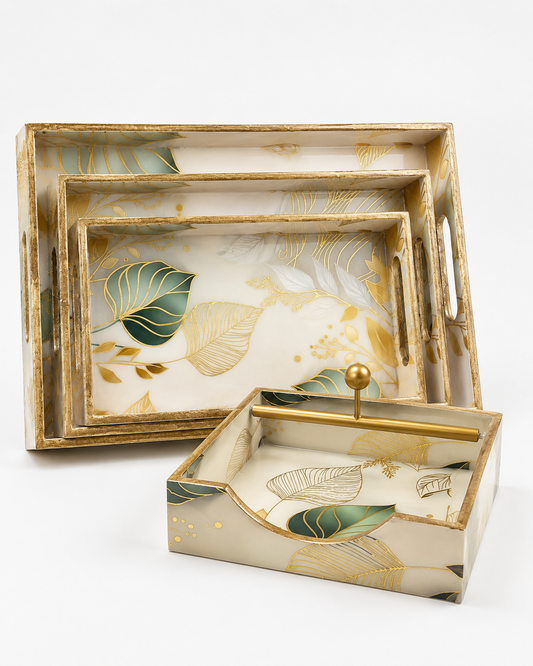 Leaf-design nesting serving tray set of 3 with matching open tissue holder and gold accents.