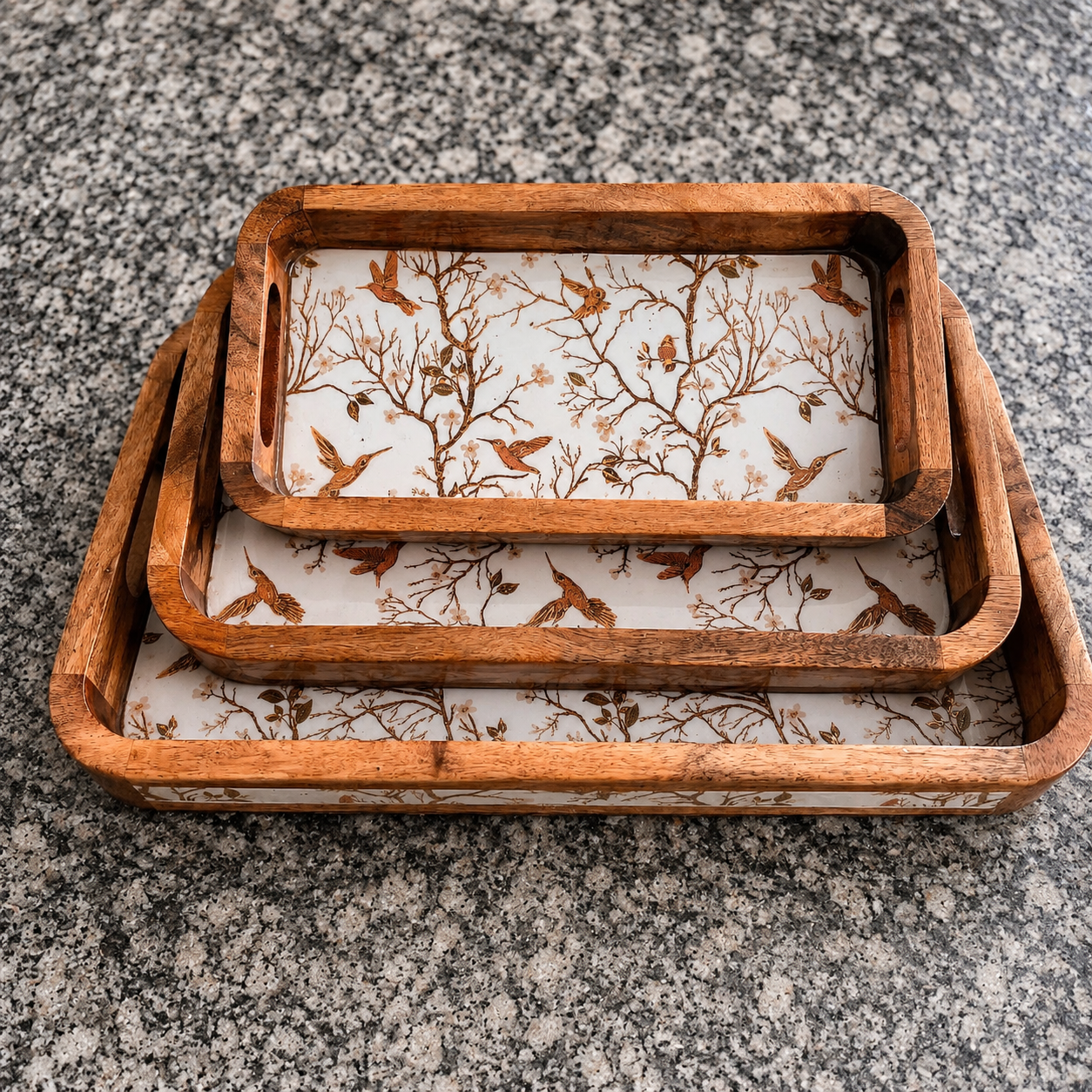 Stacked bird and branch waterproof mango wood enamel tray set with natural wooden frame on granite surface